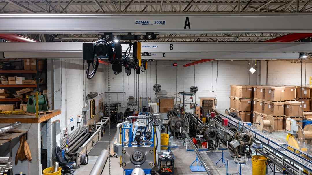 Ceiling-Mounted Crane Supports Pipe Handling at Omega Flex