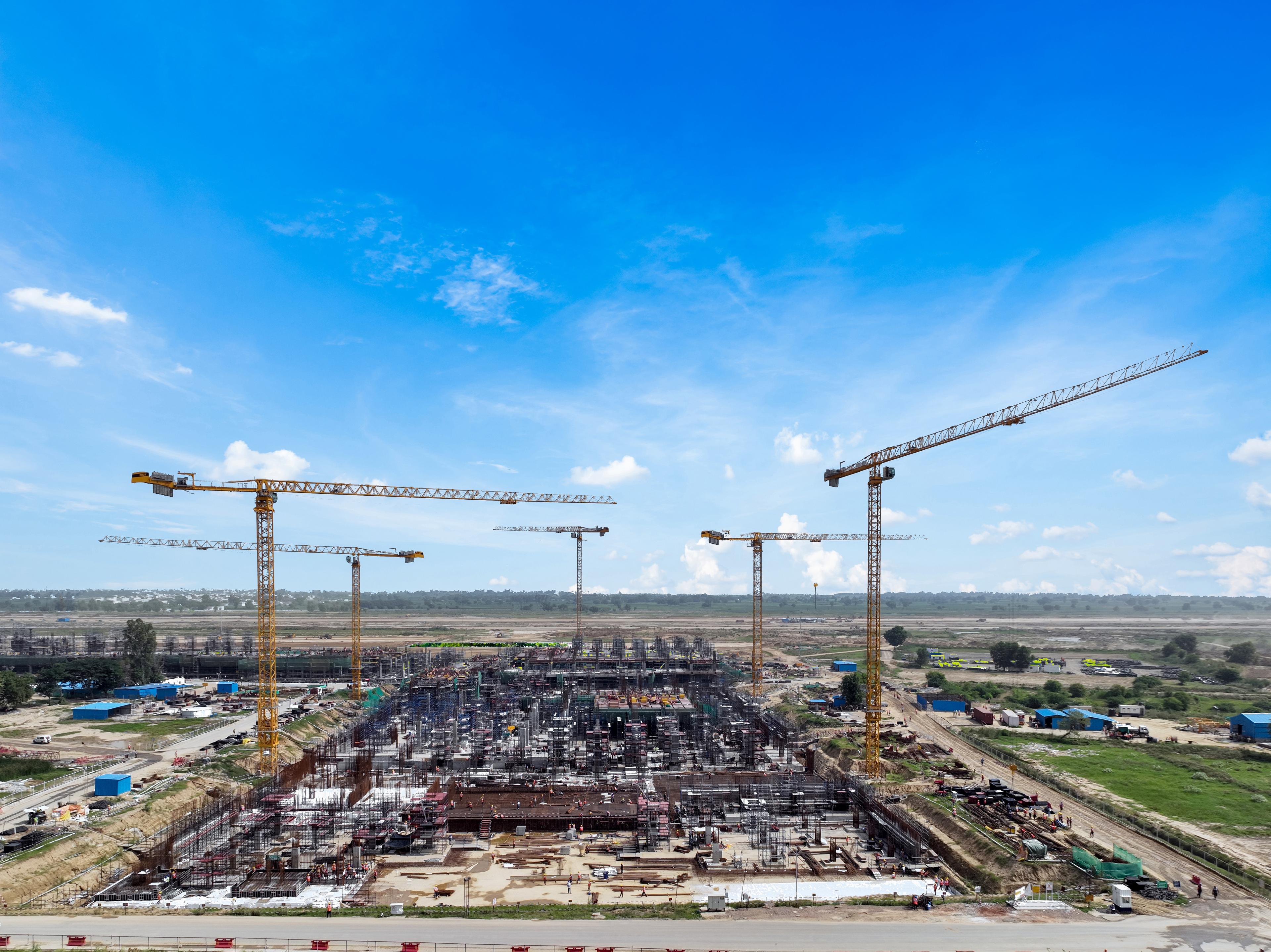 5 Potain Cranes Heading Construction of New India Airport