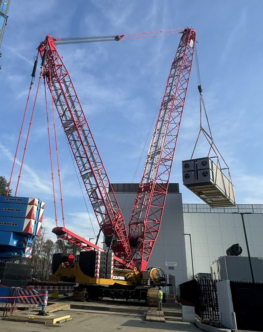 SANY crane lifting load on jobsite